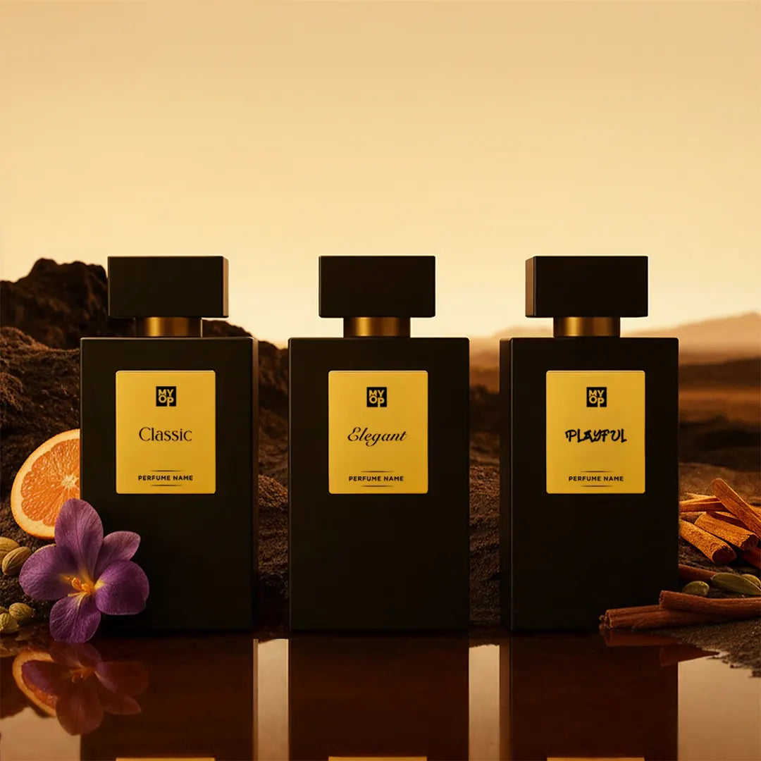 Three perfume bottles labeled 'Classic', 'Elegant', and 'Playful' on a reflective surface with a warm background.
