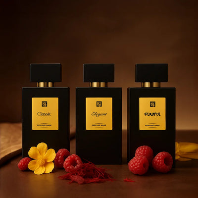 Three black perfume bottles labeled 'Classic', 'Elegant', and 'Playful' on a wooden surface with flowers and berries.